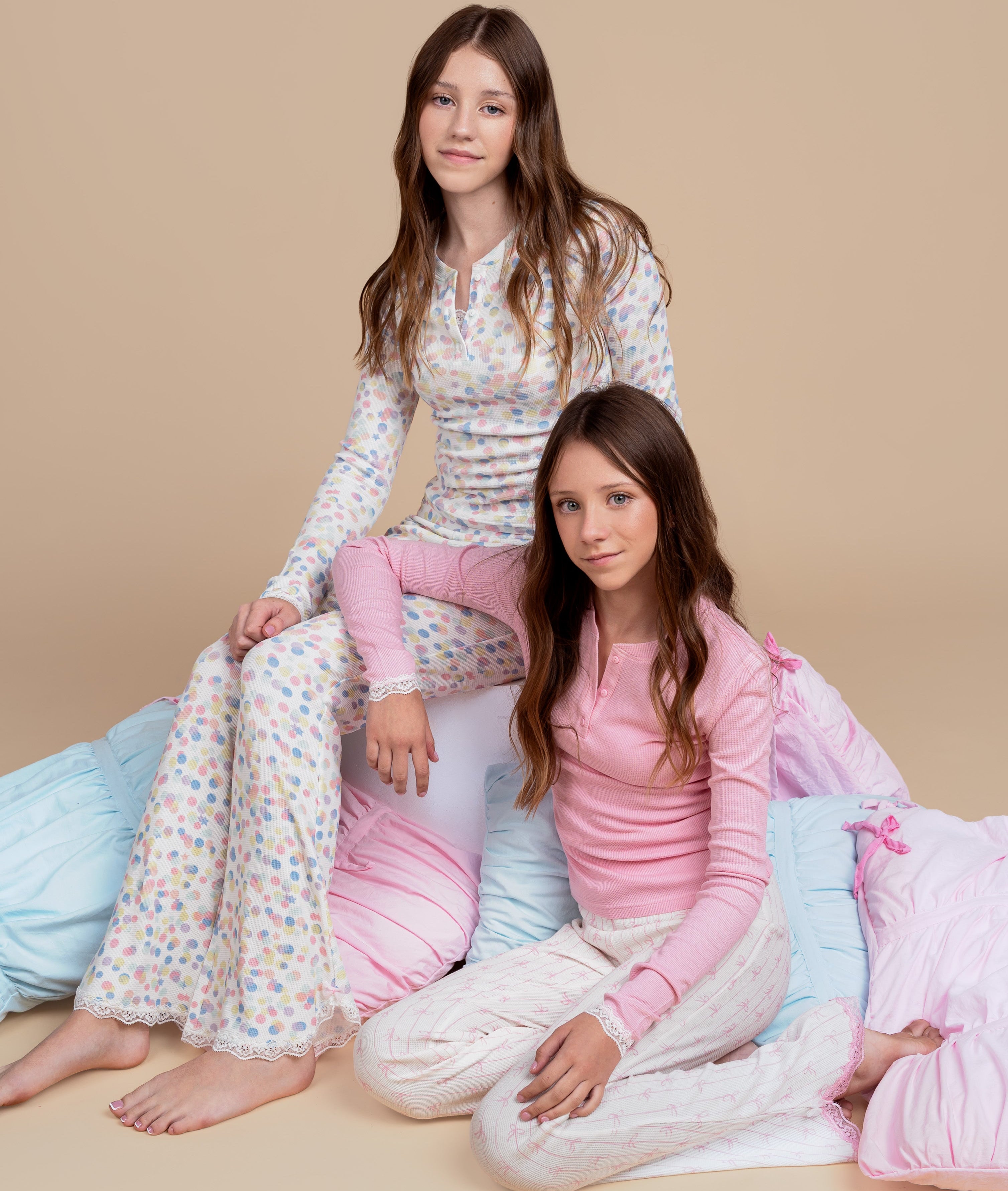 tween and teen girls in Dream Queen Co wearing pastel confetti polka dot and coquette pink bow pjs pyjamas lounge set