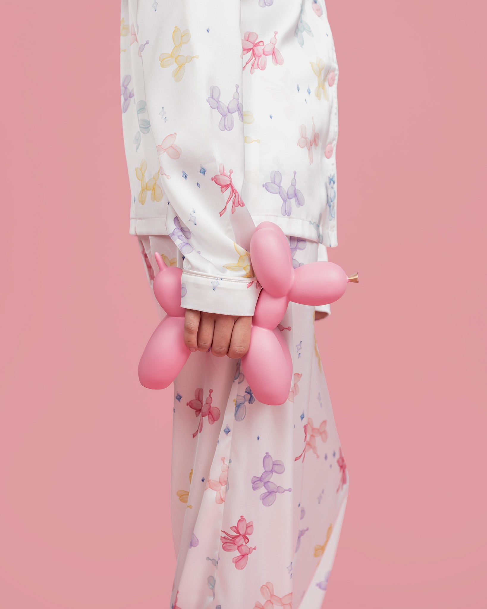 Model wearing Dream Queen Co. Sleep Cute Long sleeve satin set in Sugar Pups Balloon Dog pastel Print