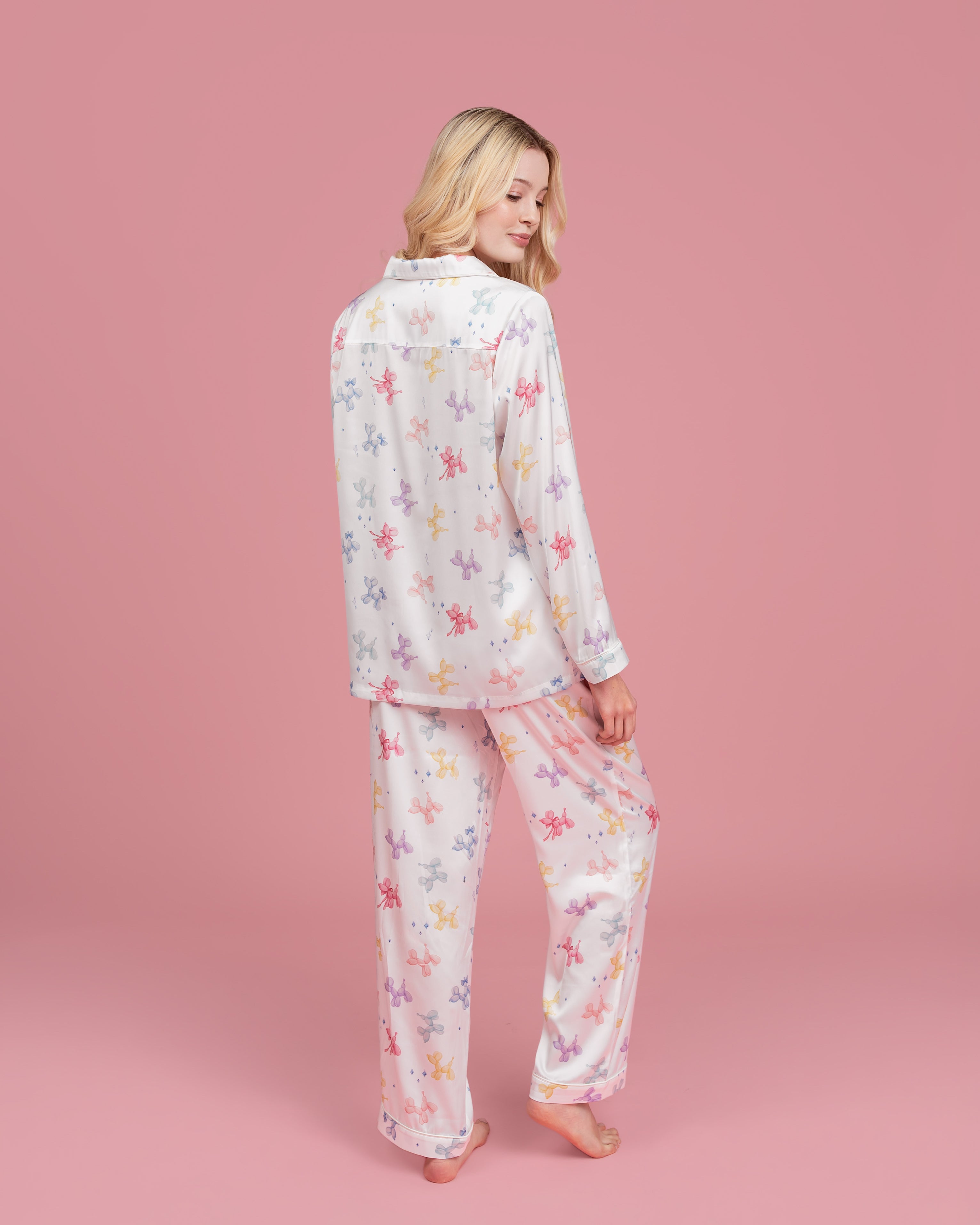 Model wearing Dream Queen Co. Sleep Cute Long sleeve satin set in Sugar Pups Balloon Dog pastel Print